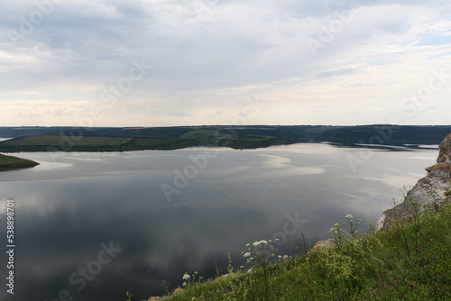 A calm smooth water view. The landscape of Bakota  Dniester river  Ukraine. The banks of a large river.