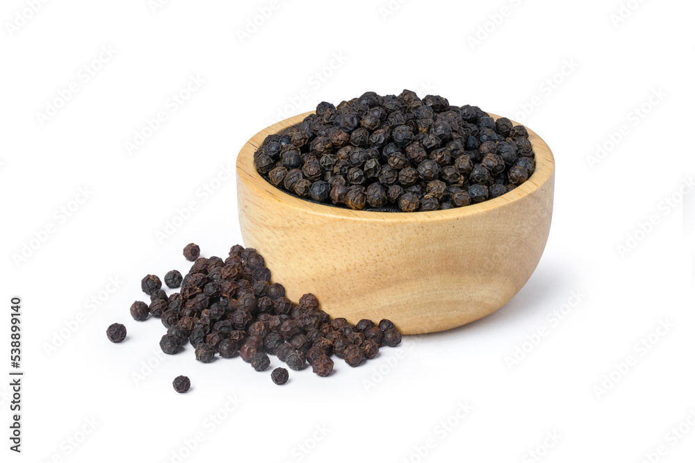 Black pepper in wooden bowl isolated on white background. Black pepper in wooden bowl isolated on white background.