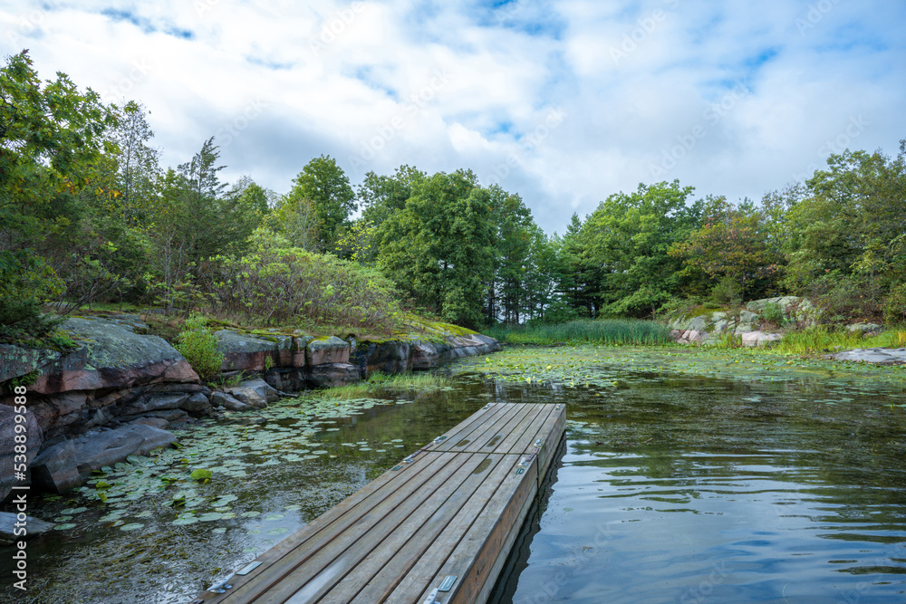 Dock in a bay near Beau Rivage Island in the Thousand Islands in Ontario