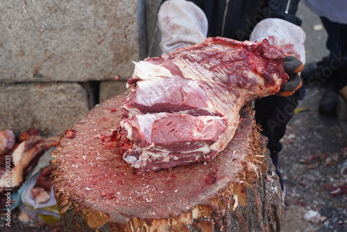 Almaty, Kazakhstan - 10.15.2022 : Preparation of beef meat for sale on the market.