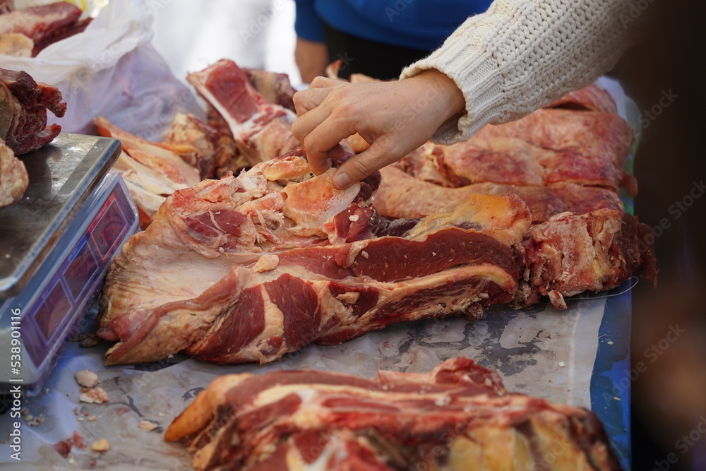 Almaty, Kazakhstan - 10.15.2022 : Sale of beef meat on the market. Almaty, Kazakhstan - 10.15.2022 : Sale of beef meat on the market.