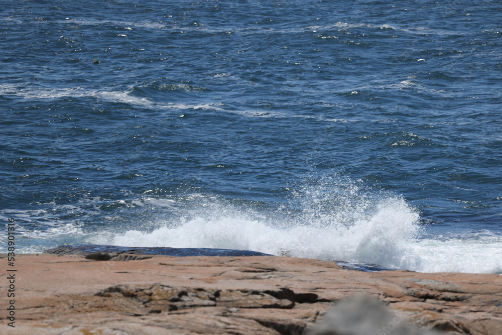 Ocean crashing against a rocky shore