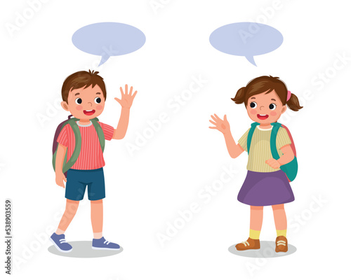 two schoolkids with backpack boy and girl say goodbye or hello waving hands to each others
