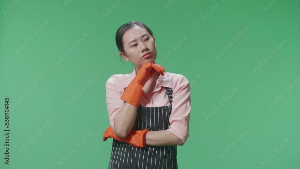 Asian Female Housekeeper With An Apron Thinking About Something And Looking Around Then Raising Her Index Finger In The Green Screen Studio
Asian Female Housekeeper With An Apron Thinking About Something And Looking Around Then Raising Her Index Finger In The Green Screen Studio