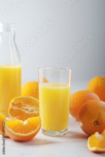 Oranges and orange juice in glasses