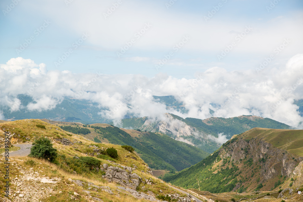 Amaizing sunset view on Durmitor mountains, National Park, Mediterranean, Montenegro, Balkans, Europe. Bright summer view from Sedlo pass. Instagram picture. The road near the house in the mountains.