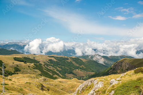 Amaizing sunset view on Durmitor mountains, National Park, Mediterranean, Montenegro, Balkans, Europe. Bright summer view from Sedlo pass. Instagram picture. The road near the house in the mountains.
