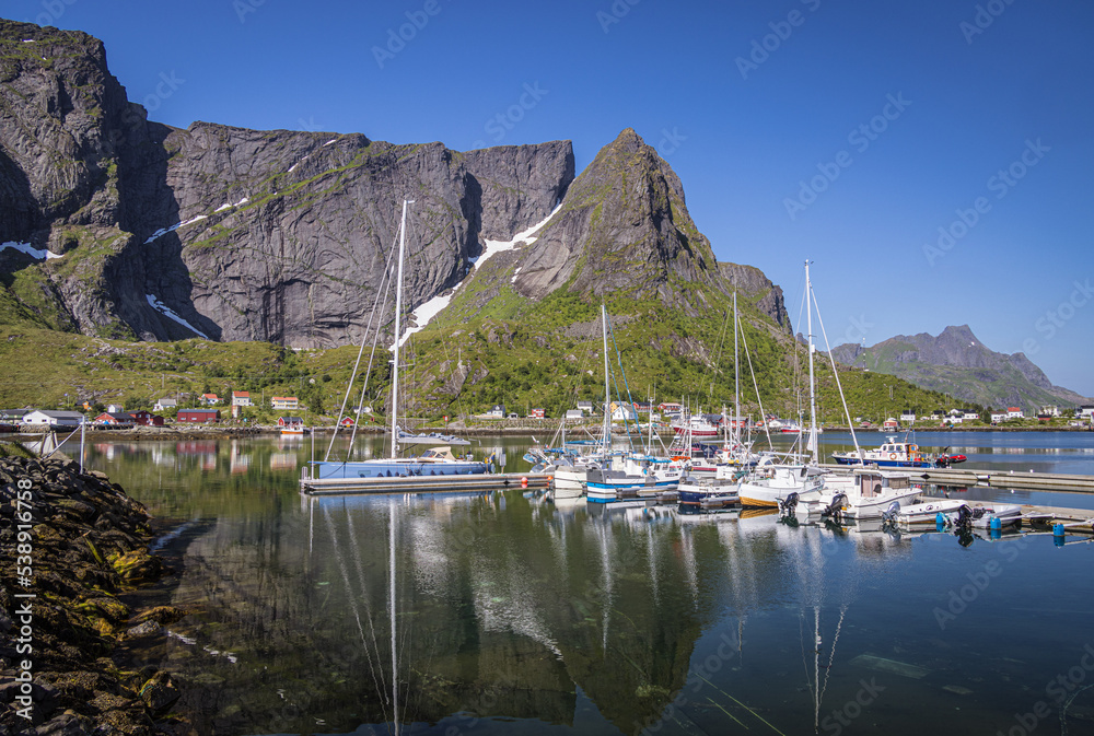 Mountain and boats in the harbour, Reine, Moskenesoya, Lofoten Islands, Nordland, Norway