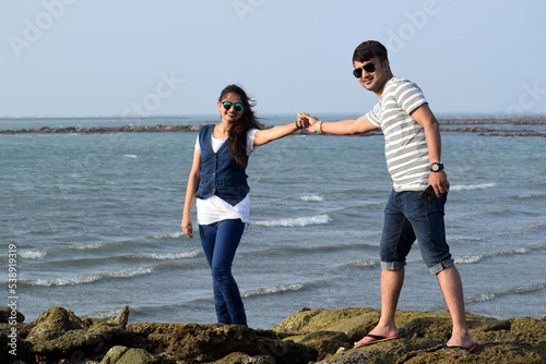 Young Asian couple holding their hands as a sign of love. Made for each other, a pair of lovers. Happy valentine day