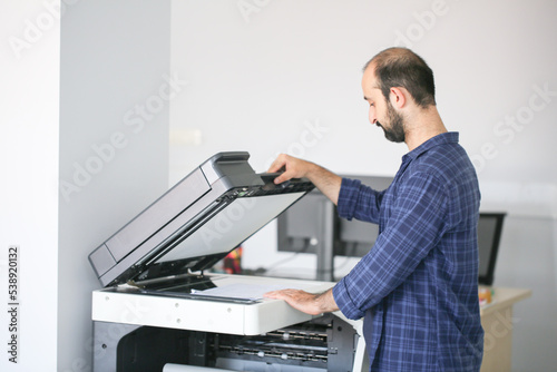 an employee making a photocopy