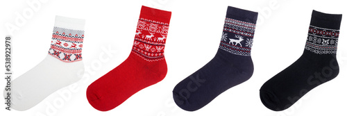 Socks of various colors with nordic ornament isolated on white photo