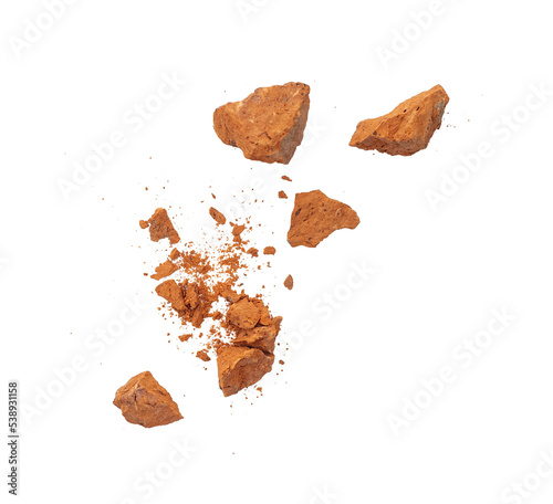 Flying pieces and powder of broken red brick isolated on white, PNG photo