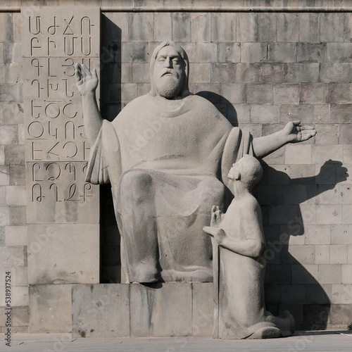 Mesrop Mashtots (Armenian linguist, theologian, creator of the Armenian alphabet) and Koryun (Armenian historian) monument on sunny evening. Yerevan, Armenia. photo