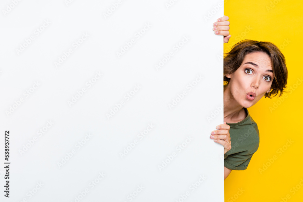 Photo of astonished adorable lady look out empty space new boutique low price stylish collection isolated on yellow color background Photo of astonished adorable lady look out empty space new boutique low price stylish collection isolated on yellow color background