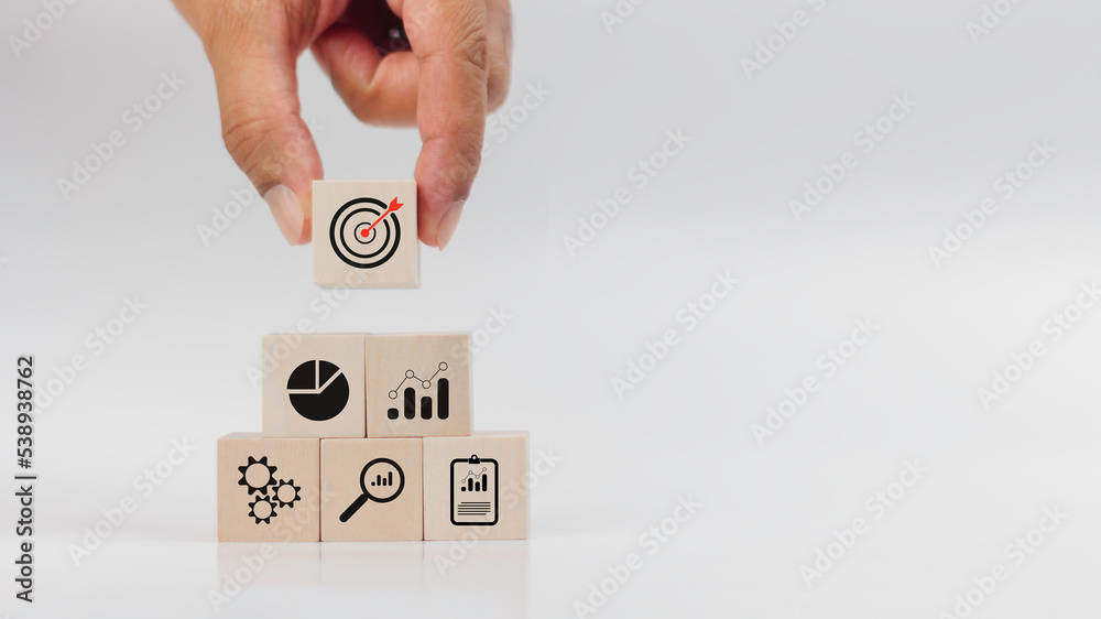 Hand stacking wood block with icon about business strategy and action ...
