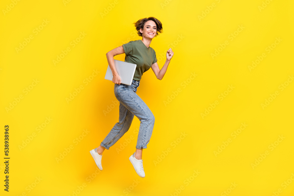 Full length photo of charming positive lady walk empty space hurry black friday sale modern device shop isolated on yellow color background