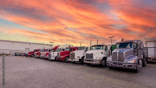 Lined up Semi trucks on a p...
