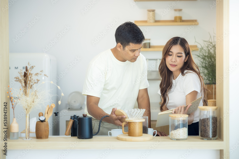 Couple or asian people to make, learn to brew coffee together in kitchen home. Include guide book, cup, mug, bottle, kitchenware on table. Concept for morning lifestyle, love, family, relationship.
Couple or asian people to make, learn to brew coffee together in kitchen home. Include guide book, cup, mug, bottle, kitchenware on table. Concept for morning lifestyle, love, family, relationship.