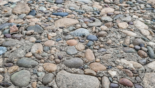 Pebble stones texture, selective focus.