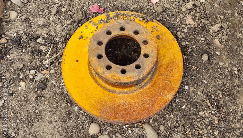 Rusty worn out car brake disc. Natural yellow rust. Rusty worn out car brake disc. Natural yellow rust.