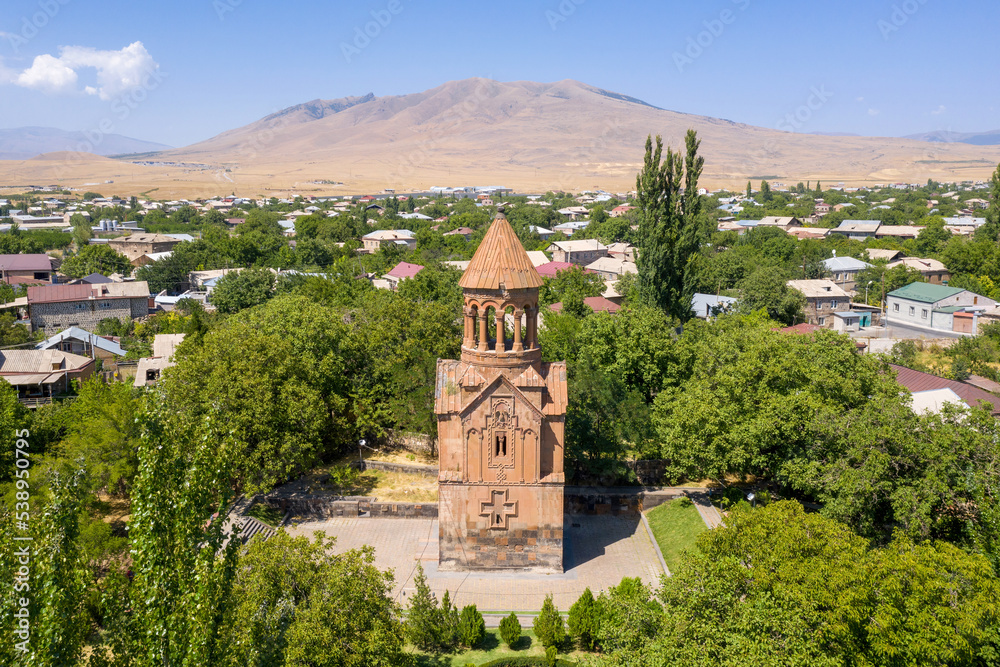 Aerial view of Surp Astvatzatzin (Holy Mother of God, 1301) Church and Arailer Mount on sunny summer day. Yeghvard, Kotayk Province, Armenia.