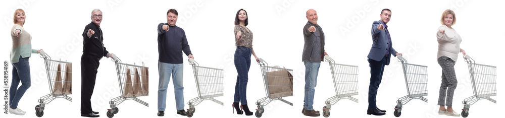 a group of people with a shopping cart point their finger at the camera a group of people with a shopping cart point their finger at the camera