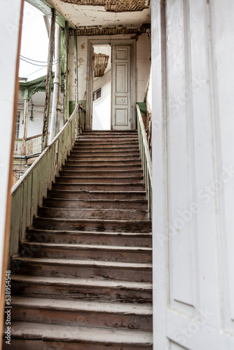 Stairs and balcony of an old Georgian wooden house in the center of Tbilisi, Georgia, Europe © jeeweevh