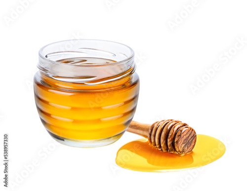 Honey isolated on white or transparent background. Jar with honey and honey dipper with drop of honey