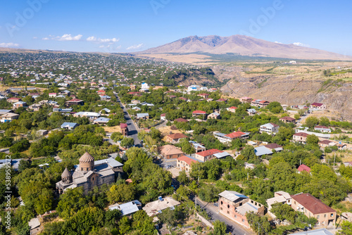 Aerial view of Mughni villag and Mount Ara on sunny summer day, Armenia. photo