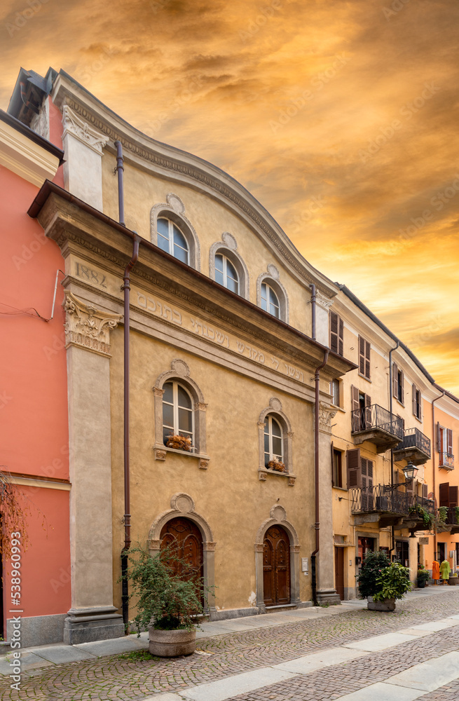 Cuneo, Piedmont, Italy - October 14, 2022: Synagogue of Cuneo (17th-19th century) in Contrada Mondovì, ancient street of the district in the historic center at sunset