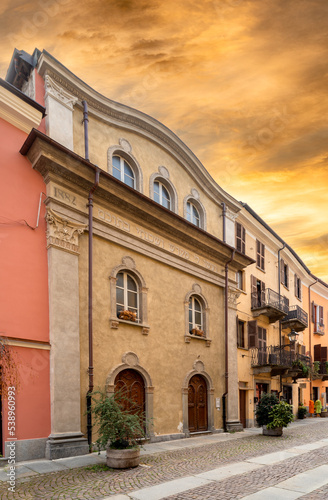 Cuneo, Piedmont, Italy - October 14, 2022: Synagogue of Cuneo (17th-19th century) in Contrada Mondovì, ancient street of the district in the historic center at sunset