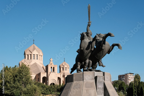 Andranik Ozanian monument and Surp Grigor Lusavorich Cathedral on sunny summer day. Yerevan, Armenia. photo