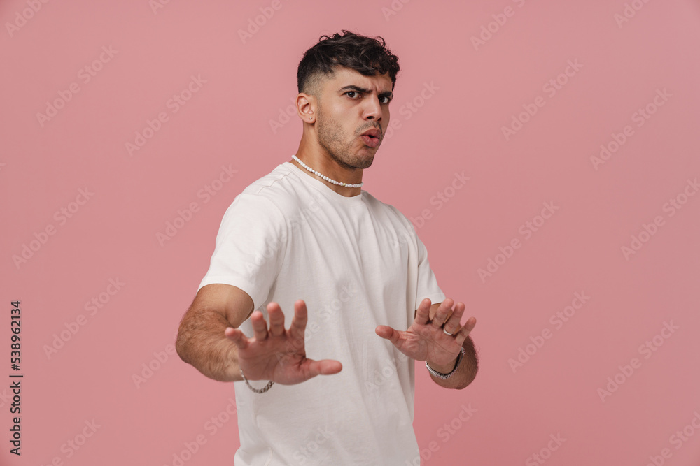 Young hadsome stylish scared man showing stop gesture with hands Young hadsome stylish scared man showing stop gesture with hands