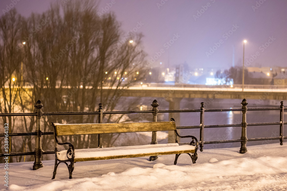winter promenade, with bench and snow