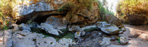 Cave and river in a canyon. Canadian Nature Background. Panorama. Little Huson Caves Park, Vancouver Island, British Columbia, Canada.