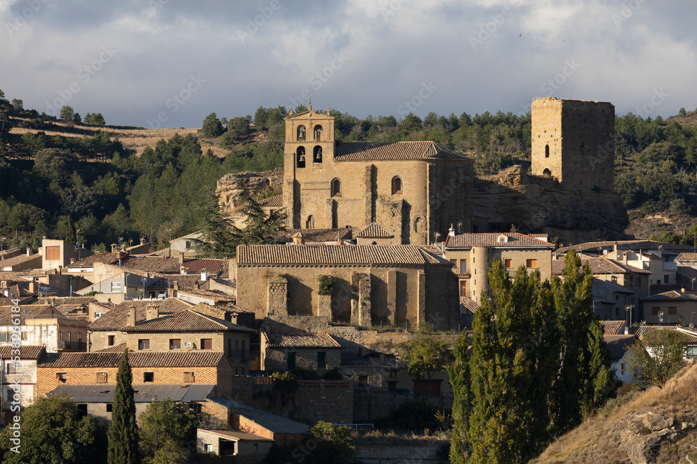 View of the church San Salvador and the town of Luesia around it, in a rural and natural environment, Aragon, Spain