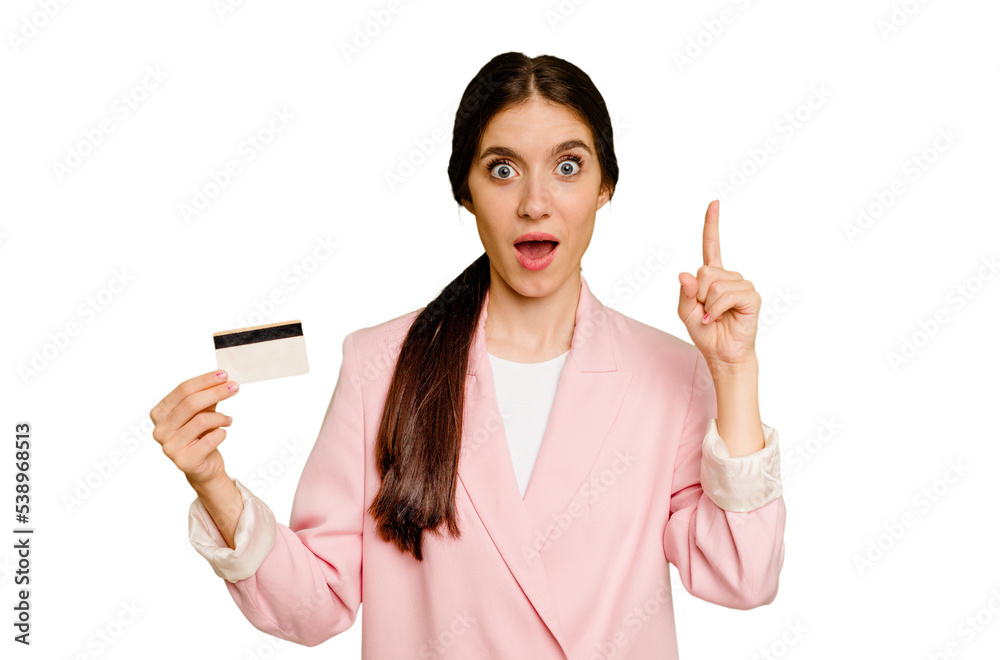 Business caucasian woman holding a credit card isolated having an idea, inspiration concept. Business caucasian woman holding a credit card isolated having an idea, inspiration concept.