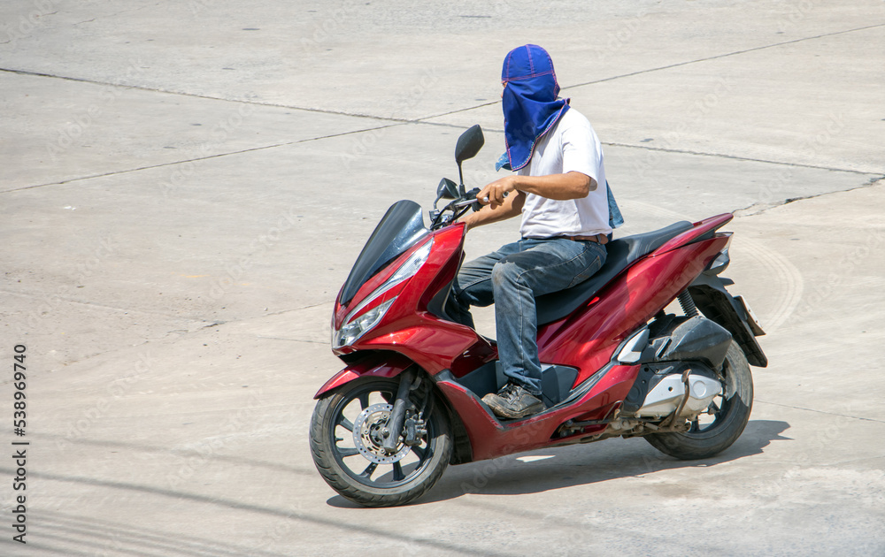 custom made wallpaper toronto digitalA man rides a motorcycle with a head protection against the sun