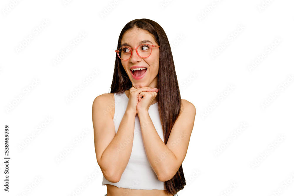 Young caucasian long hair woman isolated keeps hands under chin, is looking happily aside. Young caucasian long hair woman isolated keeps hands under chin, is looking happily aside.