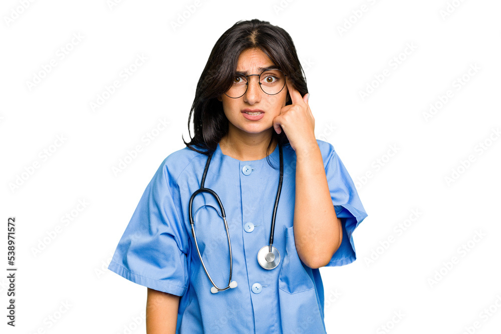 Young nurse Indian woman isolated showing a disappointment gesture with forefinger. Young nurse Indian woman isolated showing a disappointment gesture with forefinger.