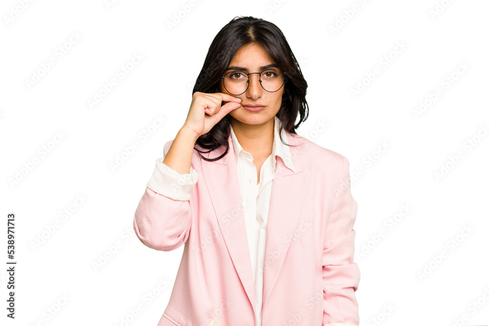 Young Indian business woman wearing a pink suit isolated with fingers on lips keeping a secret. Young Indian business woman wearing a pink suit isolated with fingers on lips keeping a secret.
