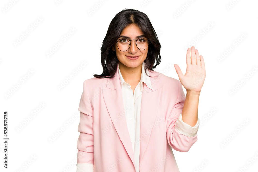 Young Indian business woman wearing a pink suit isolated smiling cheerful showing number five with fingers. Young Indian business woman wearing a pink suit isolated smiling cheerful showing number five with fingers.