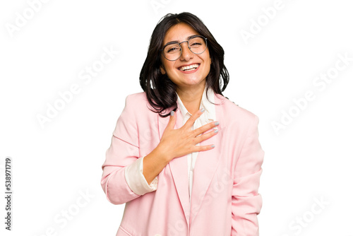 Obraz na plátně Young Indian business woman wearing a pink suit isolated laughs out loudly keeping hand on chest