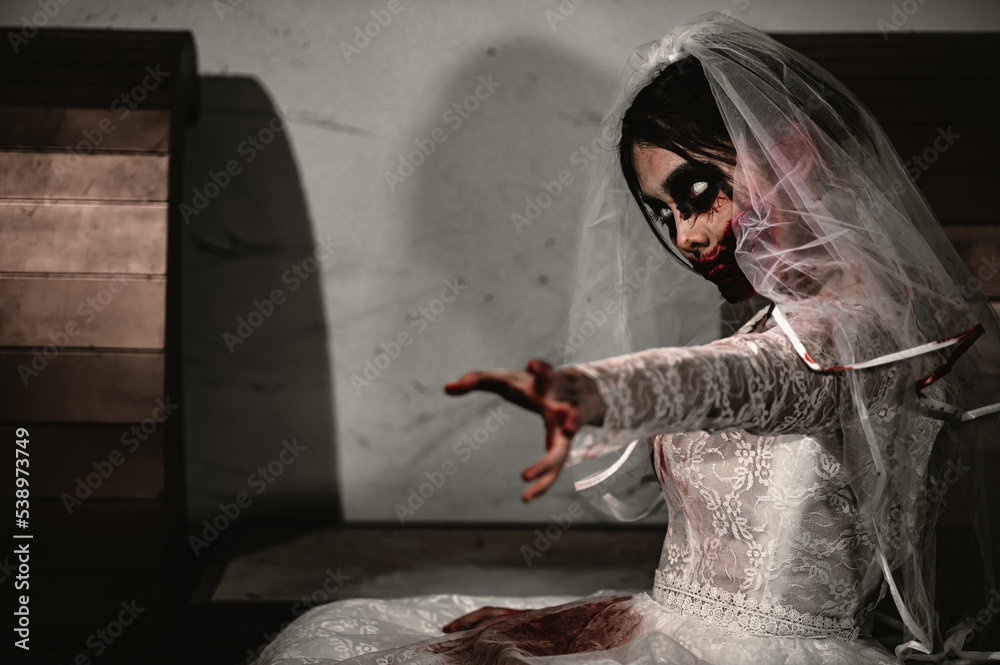 Obraz premium Halloween festival concept,Asian woman makeup ghost face,Bride zombie charactor,Horror movie wallpaper or poster