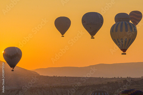 Sunrise view of hot air balloons above Cappadocia, Turkey