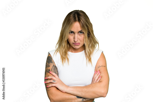 Obraz na płótnie Young caucasian woman isolated on green chroma background unhappy looking in camera with sarcastic expression