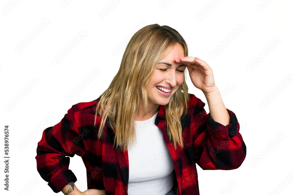 Young caucasian woman isolated on green chroma background joyful laughing a lot. Happiness concept.