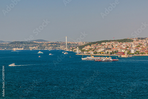 Boats and First Bosporus Bridge  15 July Martyrs Bridge  in Istanbul  Turkey