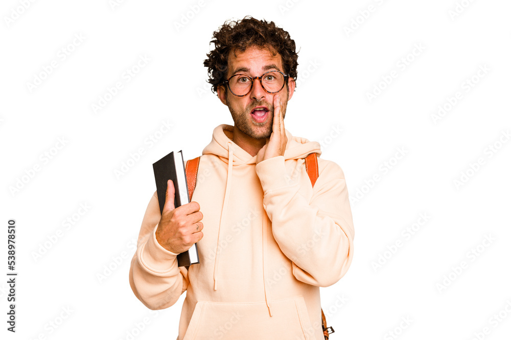 Young caucasian student man isolated is saying a secret hot braking news and looking aside Young caucasian student man isolated is saying a secret hot braking news and looking aside