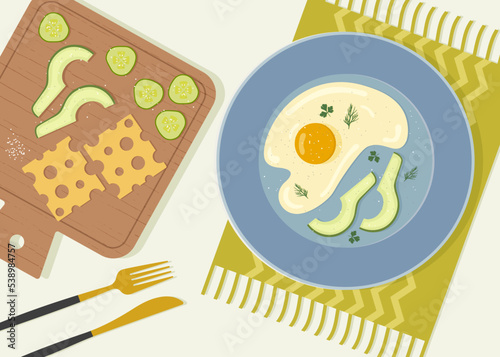 Composition of a delicious breakfast with scrambled eggs on a plate, sliced vegetables and cheese on a cutting board. View of a dining table with a tablecloth on top. Vector illustration